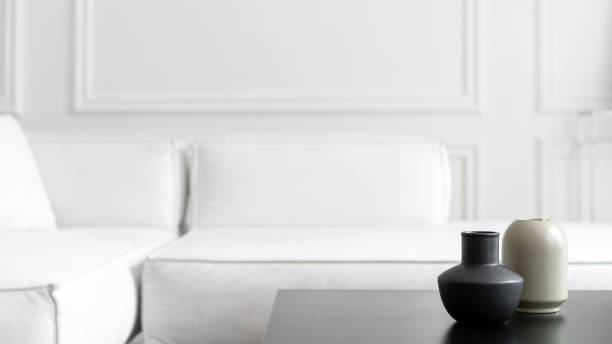 istock Grey vases on black tea table near couch 1320321113