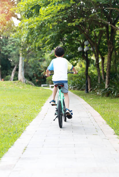 istock Chinese boy riding a bike 1320322041