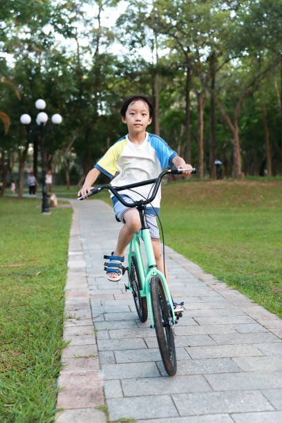 istock Chinese boy riding a bike 1320322806