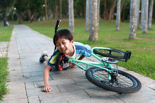 Young Chinese kid boy on his bike