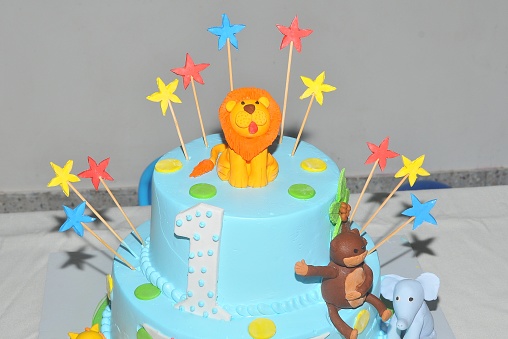 A fondant cake of lion in a first year birthday celebration