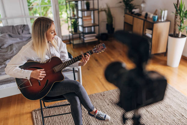 istock Woman giving online guitar classes 1320325472