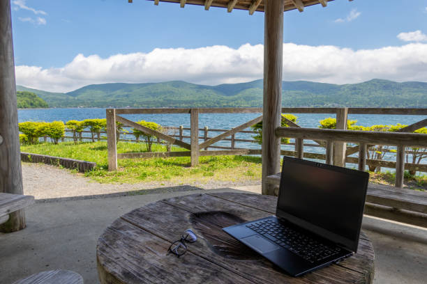 lakeside terrace with PC and glasses lakeside terrace with PC and glasses (yamanakako,Japan) holiday camp stock pictures, royalty-free photos & images