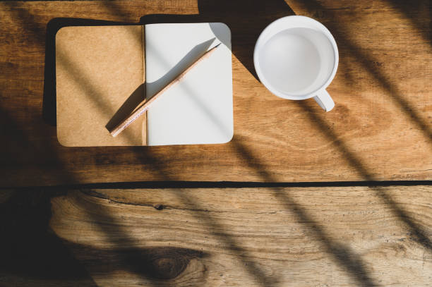 istock Top view of Open blank notebook on old wood background 1320328141