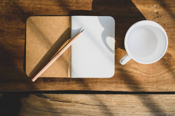 istock Top view of Open blank notebook on old wood background 1320328239