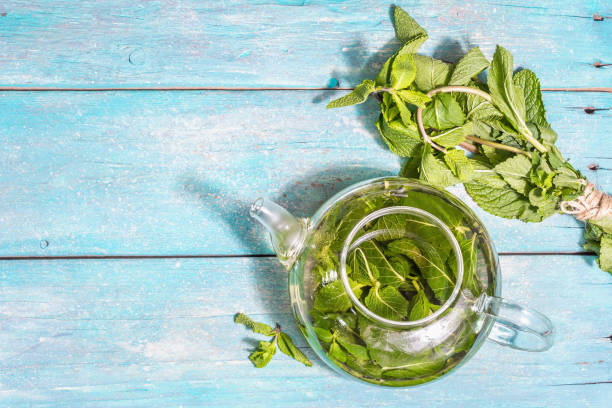 istock Teatime concept. Aromatic mint tea, ripe strawberries, sweet honey 1320332072