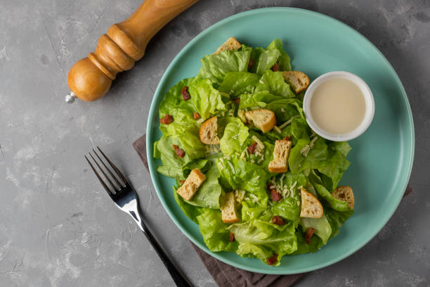 istock Caesar salad with croutons and bacon. 1320332107