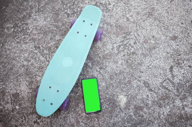 istock Skateboard and phone green screen background 1320332143