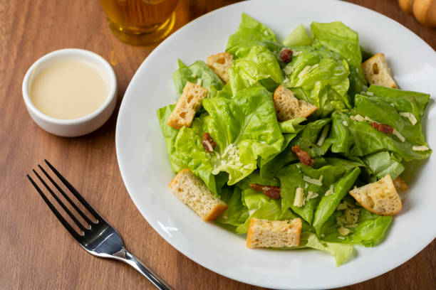 istock Caesar salad with croutons and bacon. 1320332223