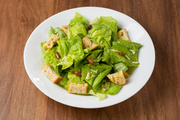 istock Caesar salad with croutons and bacon. 1320332224