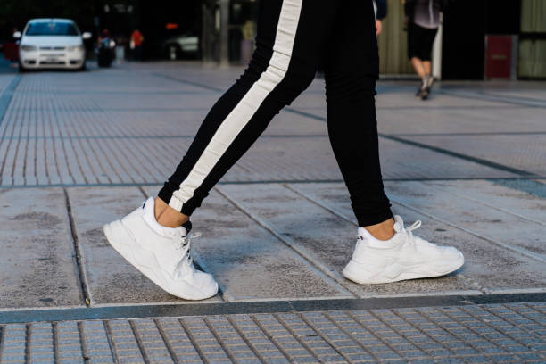 istock Young man walking down the sidewalk in sportswear. 1320335286