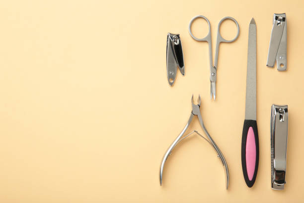 istock Tools of a manicure set on beige background with copy space. 1320338772