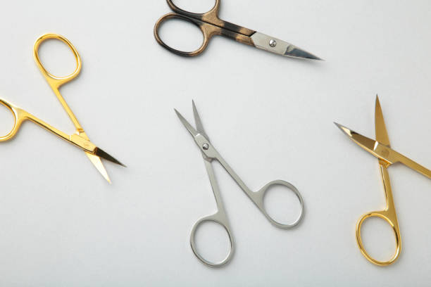 istock Scissors for manicure woman nails on grey background 1320338818