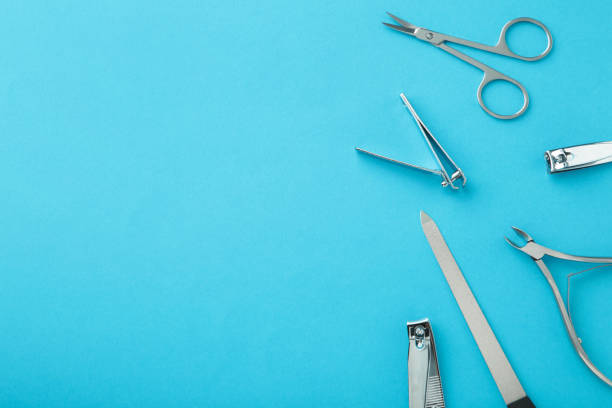istock Tools of a manicure set on blue background with copy space. 1320338896