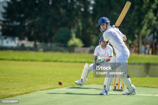 Batsman Hitting Ball On Pitch Stock Photo - Download Image Now - Sport of Cricket, Cricket Player, Match - Sport