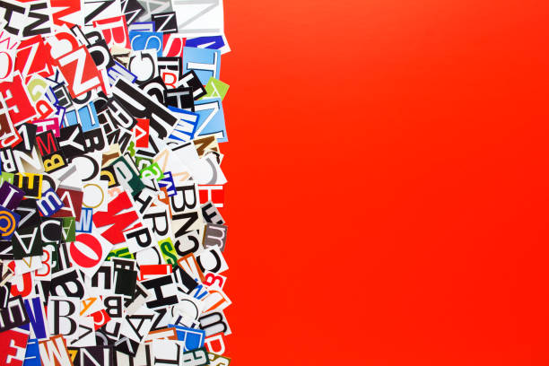 istock Alphabet letters cutting from paper magazine on red background with copy space for text. Abstract collage from clippings with newspaper magazine letters. 1320339656