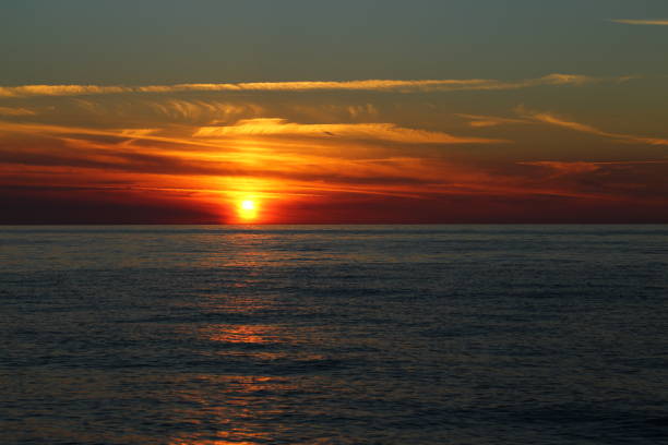 istock Sunset by the sea. 1320339922