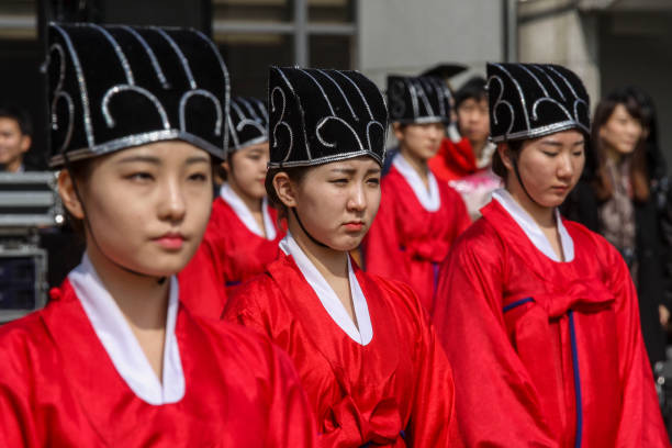 May 27, 2021-Seoul, South Korea-In this pictures taken date is Feb 25, 2015. University graduating classes costume Chosun dynasty scholar dress up with dance during an Sungkyunkwan University traditional graduate ceremony in Seoul, South Korea. Most current Korean universities follow the western style some universities are going back to more traditional dress.