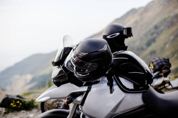 istock Motorcycle with helmets on the background of mountains 1320342617