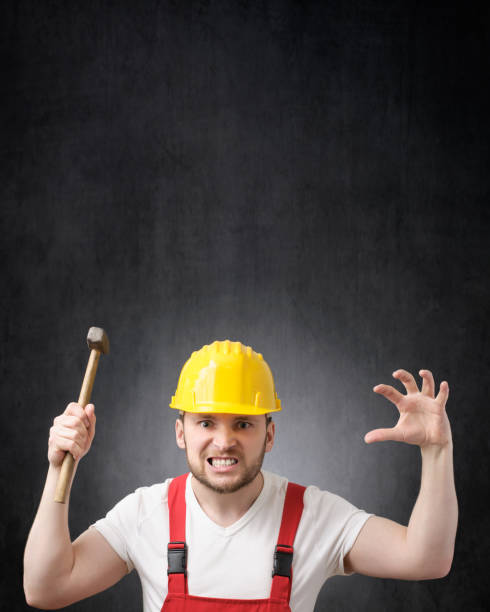 istock Portrait of a construction worker with hammer 1320344198