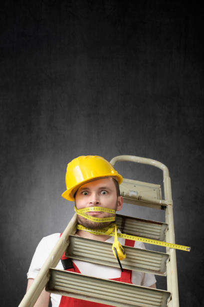 istock Portrait of a clumsy worker with measure tape 1320344217