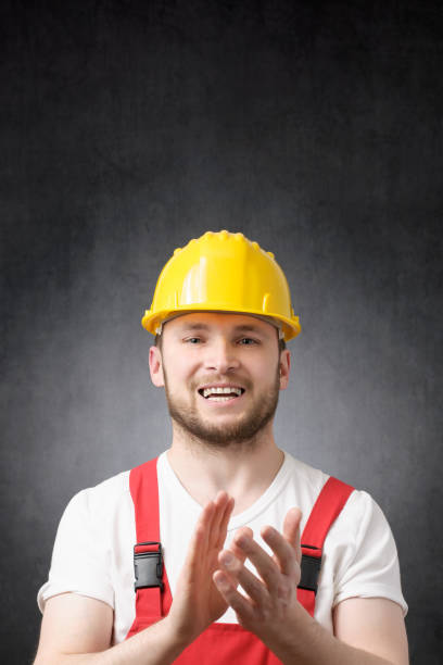 istock Portrait of a construction worker clapping his hands 1320344261