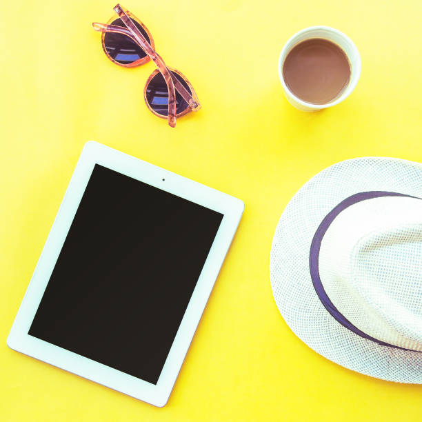 istock Tablet computer, coffee and travel accessories, flat lay. Freelancer work at summer concept. Top view, flat lay 1320344603