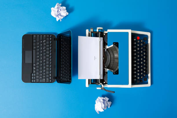 istock Digital und analog – Laptop and 80s Typewriter 1320347785