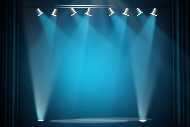 istock The concert stage theater with flood lights and abstract empty floor showcase spotlights on stage background. 1320349043