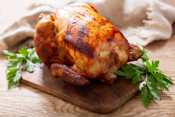 istock whole roasted chicken on a wooden board 1320351172