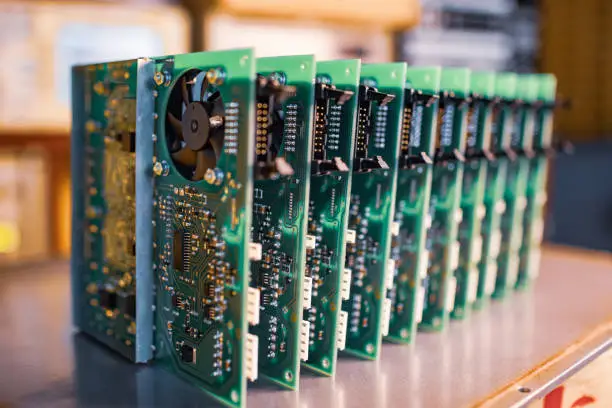 Photo of Close-up electric green embedded microcircuits in production