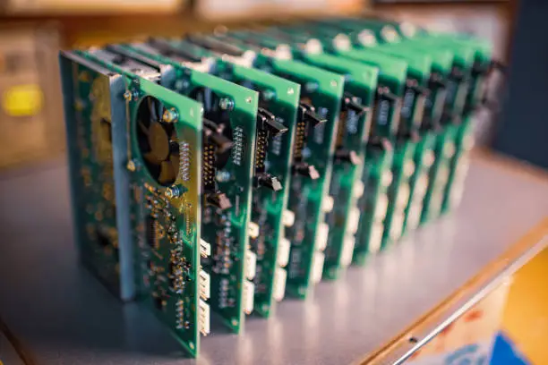 Photo of Close-up electric green embedded microcircuits in production