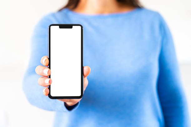 istock Unrecognizable woman showing blank smartphone screen 1320352241