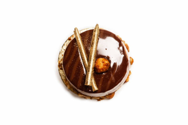 istock Chocolate and caramel cake isolated on a white background. 1320355738