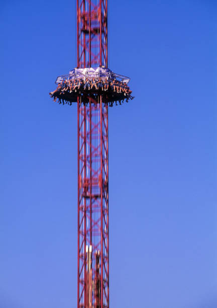 istock People on drop tower at amusement park, Florida, USA 1320356284