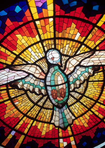 Holy Spirit stained glass in church stock photo