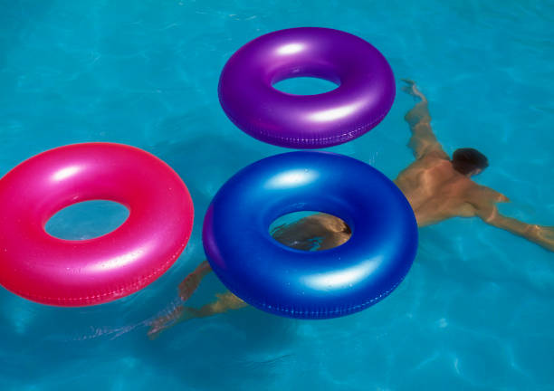 Asian Little Chinese Girl Playing in Swimming Pool with Swimming Circle