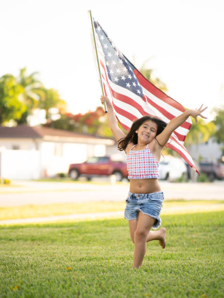 istock Cuban girl running with american flag 1320360532