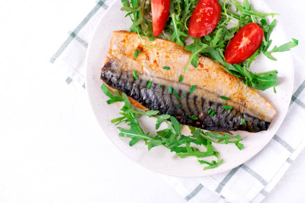 istock Roasted mackerel with arugula and tomatoes 1320361559