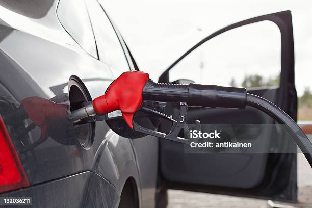 Refueling Nozzle In The Tank Car At A Gas Station Stock Photo - Download Image Now - Automobile Industry, Benzene, Black Color