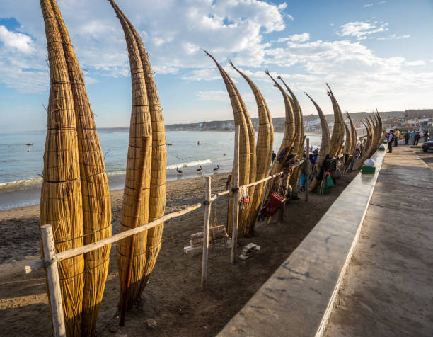 Reed canoes of the north of Peru "Caballitos de Totora" a traditional way of sailing near the coast, used by Fishermen from the North of Peru, a great tourist and cultural attraction trujillo peru stock pictures, royalty-free photos & images