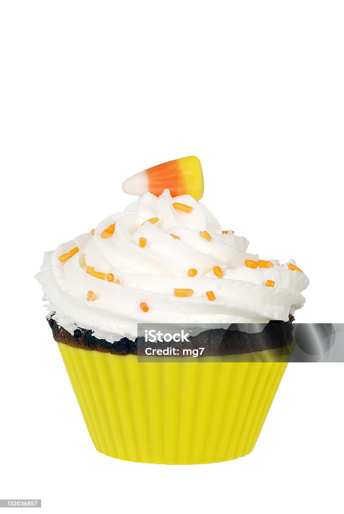 candy corn cupcake with butter cream icing isolated candy corn cupcake with butter cream icing Baked Stock Photo