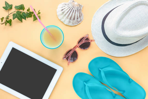istock Tablet computer and travel accessories, summer flat lay, top view 1320368888