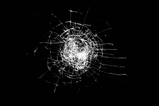 istock broken glass is insulated against a black background. white cracks 1320373764