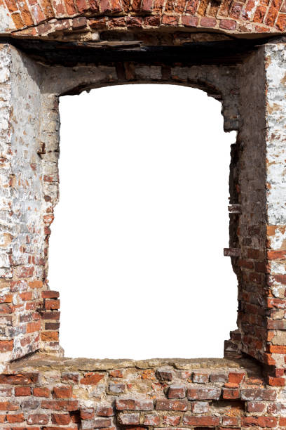 istock destroyed wall of old bricks with a hole in the middle. isolated on white background. grunge frame. vertical frame 1320374069