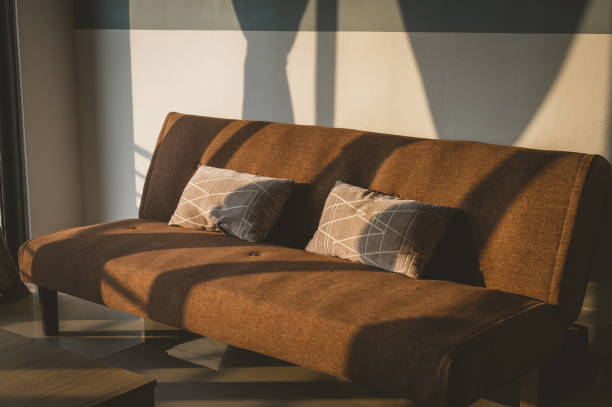 istock Close up pillow on sofa at home in morning with sunlight 1320374881
