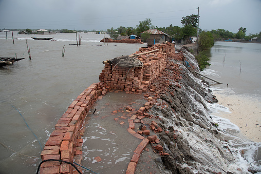 Hurricane Yaas is causing more water to rise in the river than at any other time, breaking dams and flooding residential areas in Koira sub-district of Khulna in Bangladesh, May 26, 2021.
