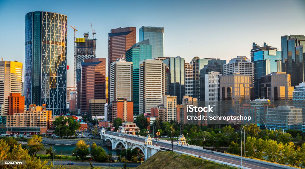 Skyline of Calgary in Canada Calgarys skyline with its skyscrapers and office buildings. Bow river and centre Street Bridge in the foreground. Alberta - Canada Calgary Stock Photo