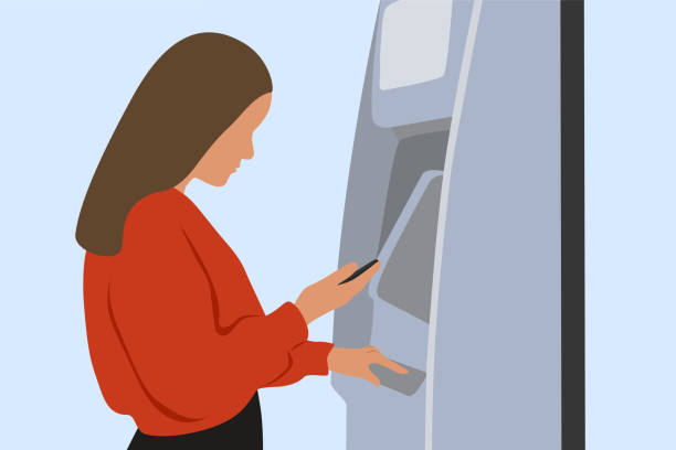 młoda kobieta stojąca w atm machine i używająca inteligentnego telefonu do wypłaty pieniędzy - pin up girl stock illustrations