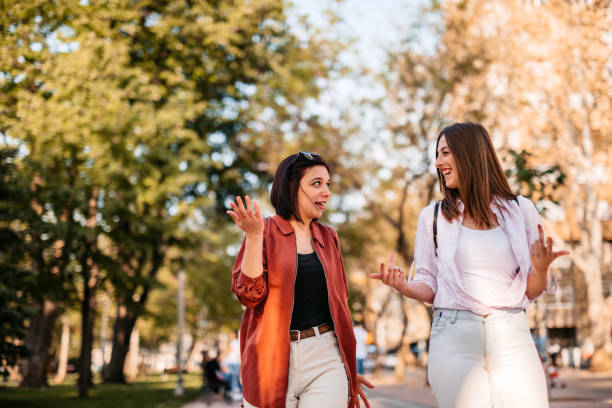 istock Two female friends talking outdoors 1320379363